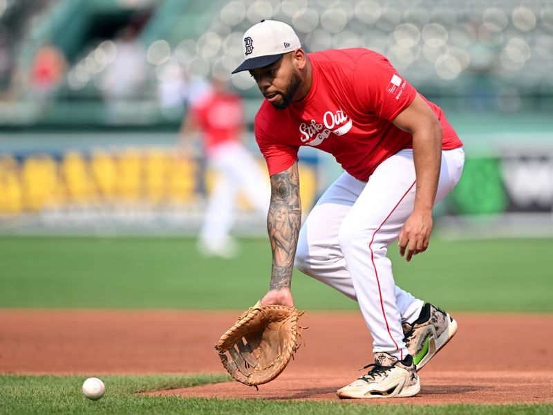 Aug 14, 2024; Boston, Massachusetts, USA; Boston Red Sox first baseman Dominic Smith (2) fields the ball during warmups before a game against the Texas Rangers at Fenway Park. Mandatory Credit: Brian Fluharty-USA TODAY Sports