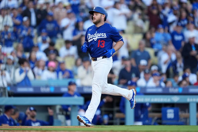 Mar 23, 2025; Los Angeles, California, USA; Los Angeles Dodgers third base Max Muncy (13) runs the bases after hitting a home run in the fifth inning against the Los Angeles Angels  at Dodger Stadium. Mandatory Credit: Kirby Lee-Imagn Images