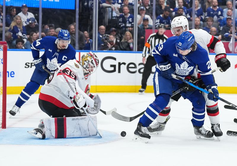 Apr 29, 2025; Toronto, Ontario, CAN; Toronto Maple Leafs left wing Matthew Knies (23) battles for the puck in front of Ottawa Senators goaltender Linus Ullmark (35) in the first period during game five of the first round of the 2025 Stanley Cup Playoffs at Scotiabank Arena. Mandatory Credit: Nick Turchiaro-Imagn Images