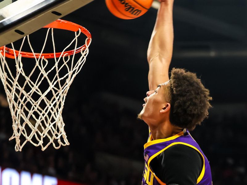 Feb 17, 2024; Columbia, South Carolina, USA; LSU Tigers forward Jalen Reed (13) dunks against the South Carolina Gamecocks in the second half at Colonial Life Arena. Mandatory Credit: Jeff Blake-USA TODAY Sports