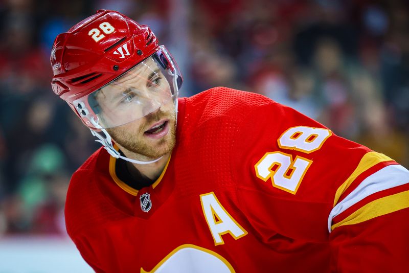 Oct 11, 2023; Calgary, Alberta, CAN; Calgary Flames center Elias Lindholm (28) during the face off against the Winnipeg Jets during the second period at Scotiabank Saddledome. Mandatory Credit: Sergei Belski-USA TODAY Sports