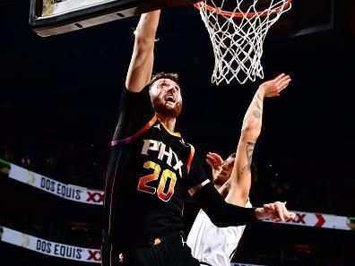 PHOENIX, AZ - DECEMBER 1: Jusuf Nurkic #20 of the Phoenix Suns drives to the basket during the game against the Denver Nuggets on December 1, 2023 at Footprint Center in Phoenix, Arizona. NOTE TO USER: User expressly acknowledges and agrees that, by downloading and or using this photograph, user is consenting to the terms and conditions of the Getty Images License Agreement. Mandatory Copyright Notice: Copyright 2023 NBAE (Photo by Barry Gossage/NBAE via Getty Images)