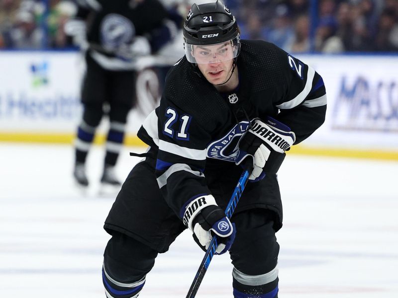 Feb 17, 2024; Tampa, Florida, USA;  Tampa Bay Lightning center Brayden Point (21) controls the puck against the Florida Panthers in the third period at Amalie Arena. Mandatory Credit: Nathan Ray Seebeck-USA TODAY Sports