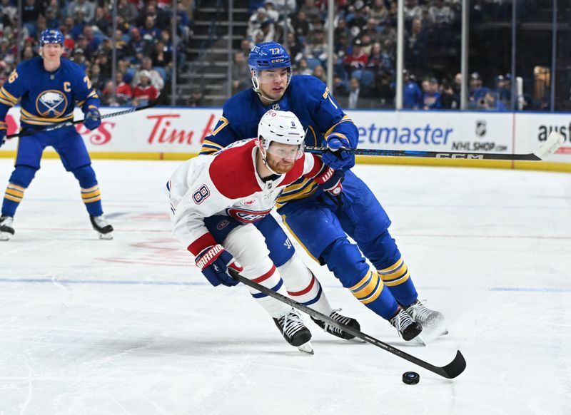 Nov 11, 2024; Buffalo, New York, USA; Montreal Canadiens defenseman Mike Matheson (8) controls the puck in front of Buffalo Sabres right wing JJ Peterka (77) in the second period at KeyBank Center. Mandatory Credit: Mark Konezny-Imagn Images