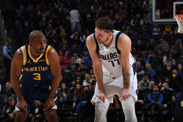 SAN FRANCISCO, CA - DECEMBER 30: Chris Paul #3 of the Golden State Warriors and Luka Doncic #77 of the Dallas Mavericks during the game  on December 30, 2023 at Chase Center in San Francisco, California. NOTE TO USER: User expressly acknowledges and agrees that, by downloading and or using this photograph, user is consenting to the terms and conditions of Getty Images License Agreement. Mandatory Copyright Notice: Copyright 2023 NBAE (Photo by Noah Graham/NBAE via Getty Images)