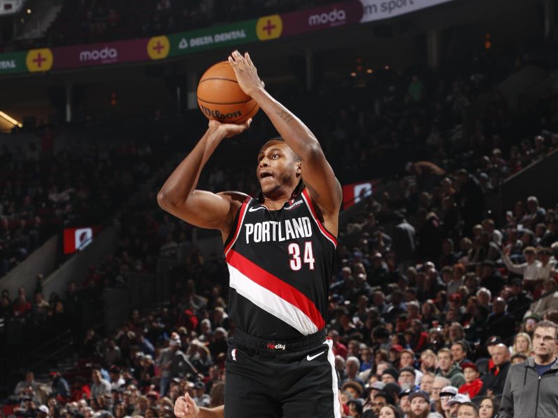 PORTLAND, OR - DECEMBER 1: Jabari Walker #34 of the Portland Trail Blazers shoots a three point basket during the game against the Dallas Mavericks on December 1, 2024 at the Moda Center Arena in Portland, Oregon. NOTE TO USER: User expressly acknowledges and agrees that, by downloading and or using this photograph, user is consenting to the terms and conditions of the Getty Images License Agreement. Mandatory Copyright Notice: Copyright 2024 NBAE (Photo by Cameron Browne/NBAE via Getty Images)