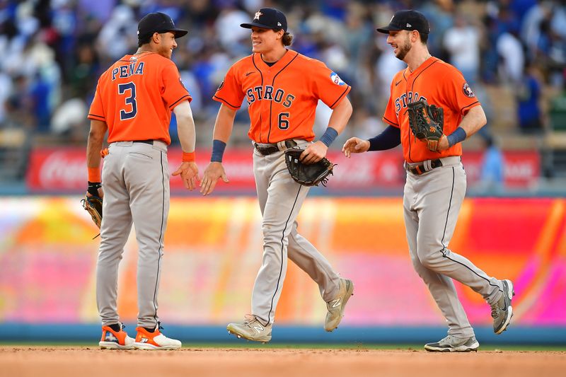 Jun 25, 2023; Los Angeles, California, USA; Houston Astros shortstop Jeremy Pena (3) center fielder Jake Meyers (6) and right fielder Kyle Tucker (30)celebrate the victory against the Los Angeles Dodgers at Dodger Stadium. Mandatory Credit: Gary A. Vasquez-USA TODAY Sports