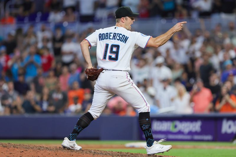 Jul 30, 2023; Miami, Florida, USA; Miami Marlins relief pitcher David Robertson (19) reacts after defeating the Detroit Tigers at loanDepot Park. Mandatory Credit: Sam Navarro-USA TODAY Sports