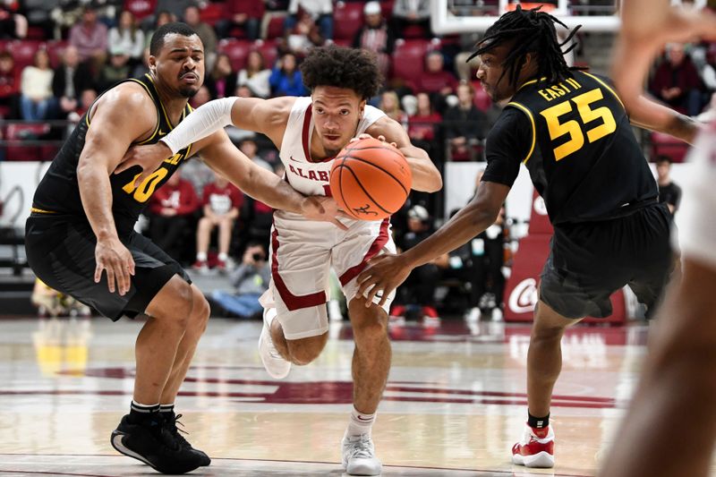 Jan 16, 2024; Tuscaloosa, Alabama, USA; Alabama guard Mark Sears (1) dives between Missouri guard Nick Honor (10) and Missouri guard Sean East II (55) in the game at Coleman Coliseum. Mandatory Credit: Gary Cosby Jr.-USA TODAY Sports