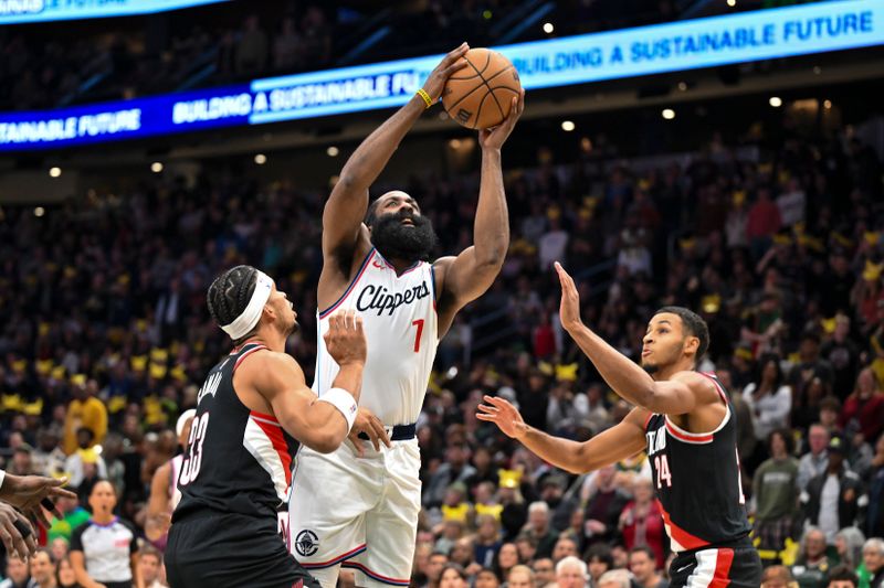 SEATTLE, WASHINGTON - OCTOBER 11: James Harden #1 of the LA Clippers shoots over Toumani Camara #33 and Kris Murray #24 of the Portland Trail Blazers during the first quarter of the Rain City Showcase game at Climate Pledge Arena on October 11, 2024 in Seattle, Washington. NOTE TO USER: User expressly acknowledges and agrees that, by downloading and or using this photograph, User is consenting to the terms and conditions of the Getty Images License Agreement. (Photo by Alika Jenner/Getty Images)