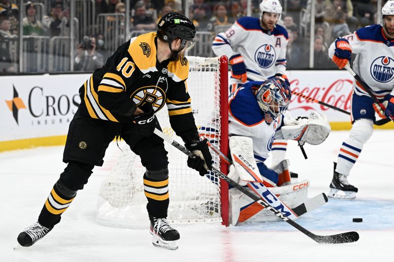 Mar 9, 2023; Boston, Massachusetts, USA; Boston Bruins left wing A.J. Greer (10) attempts a shot on Edmonton Oilers goaltender Stuart Skinner (74) during the first period at the TD Garden. Mandatory Credit: Brian Fluharty-USA TODAY Sports