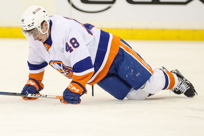 Sep 26, 2023; New York, New York, USA;  New York Islanders forward Matthew Maggio (48) attempts to get up after an injury in the first period against the New York Rangers at Madison Square Garden. Mandatory Credit: Wendell Cruz-USA TODAY Sports