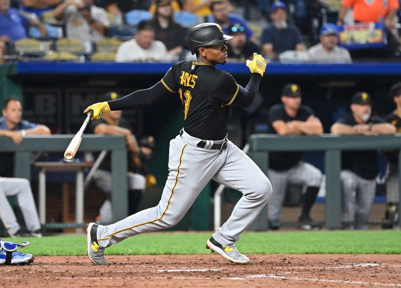 Aug 28, 2023; Kansas City, Missouri, USA;  Pittsburgh Pirates third baseman Ke'Bryan Hayes (13) singles in the fifth inning against the Kansas City Royals at Kauffman Stadium. Mandatory Credit: Peter Aiken-USA TODAY Sports