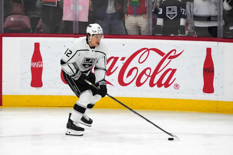 Jan 11, 2024; Sunrise, Florida, USA; Los Angeles Kings left wing Trevor Moore (12) warms up prior to the game against the Florida Panthers at Amerant Bank Arena. Mandatory Credit: Jasen Vinlove-USA TODAY Sports