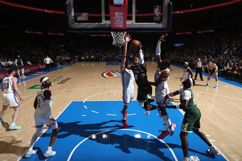 OKLAHOMA CITY, OK - APRIL 12: Khris Middleton #22 of the Milwaukee Bucks drives to the basket during the game against the Oklahoma City Thunder on April 12, 2024 at Paycom Arena in Oklahoma City, Oklahoma. NOTE TO USER: User expressly acknowledges and agrees that, by downloading and or using this photograph, User is consenting to the terms and conditions of the Getty Images License Agreement. Mandatory Copyright Notice: Copyright 2024 NBAE (Photo by Zach Beeker/NBAE via Getty Images)