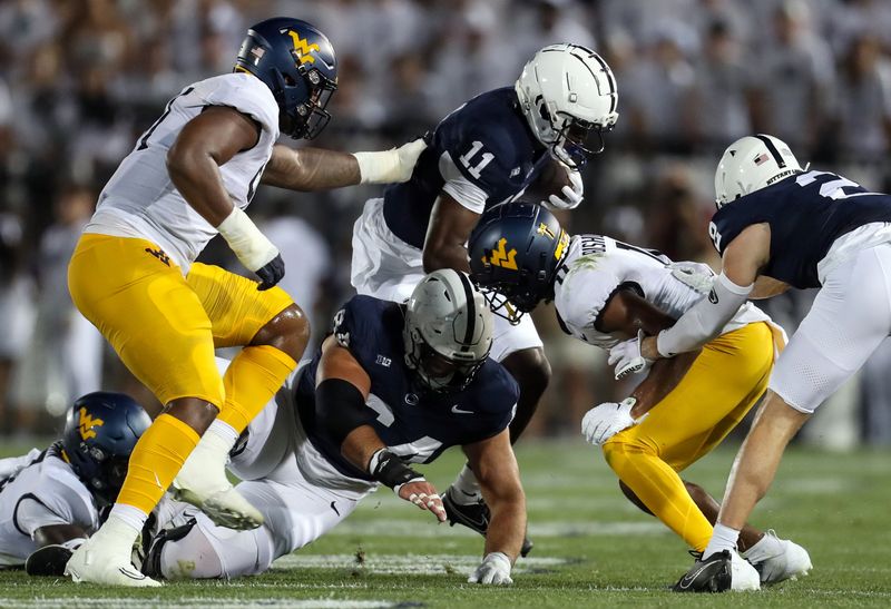 Sep 2, 2023; University Park, Pennsylvania, USA; Penn State Nittany Lions wide receiver Malik McClain (11) runs the ball against the West Virginia Mountaineers during the second quarter at Beaver Stadium. Mandatory Credit: Matthew O'Haren-USA TODAY Sports