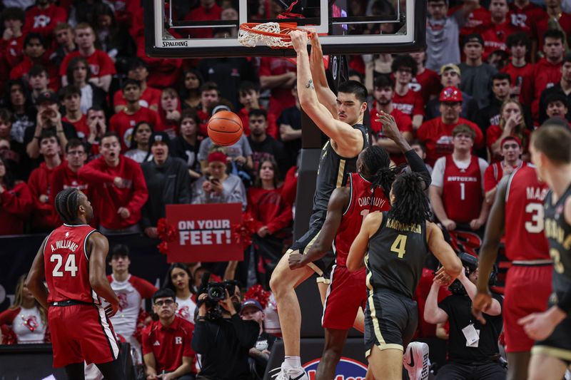 Jan 28, 2024; Piscataway, New Jersey, USA; Purdue Boilermakers center Zach Edey (15) dunks the ball against Rutgers Scarlet Knights center Clifford Omoruyi (11) during the second half at Jersey Mike's Arena. Mandatory Credit: Vincent Carchietta-USA TODAY Sports