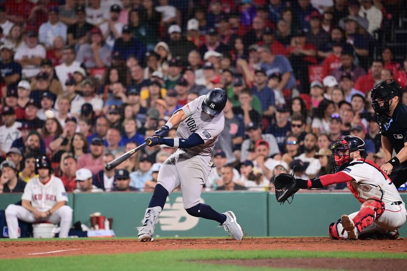 Jul 28, 2024; Boston, Massachusetts, USA; New York Yankees third baseman Oswaldo Cabrera (95) hits a ground rule RBI double during the eighth inning against the Boston Red Sox  at Fenway Park. Mandatory Credit: Eric Canha-USA TODAY Sports