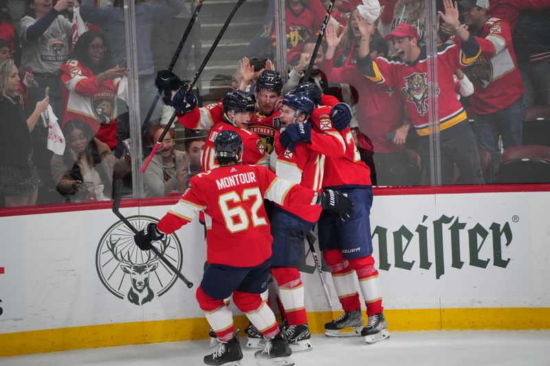 Jun 10, 2024; Sunrise, Florida, USA; Florida Panthers defenseman Niko Mikkola (77) celebrates scoring against the Edmonton Oilers during the second period in game two of the 2024 Stanley Cup Final at Amerant Bank Arena. Mandatory Credit: Jim Rassol-USA TODAY Sports