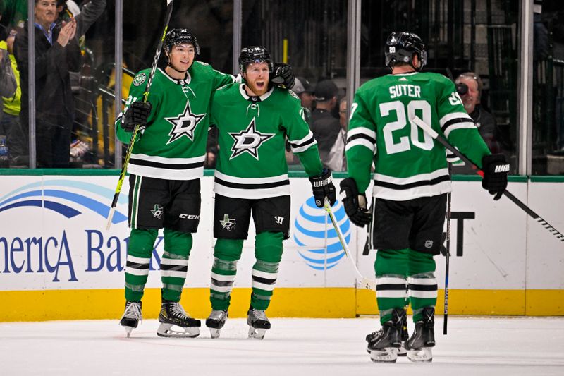 Oct 27, 2022; Dallas, Texas, USA; Dallas Stars left wing Jason Robertson (21) and center Joe Pavelski (16) snd defenseman Ryan Suter (20) celebrates a goal scored by Robertson against the Washington Capitals during the first period at the American Airlines Center. Mandatory Credit: Jerome Miron-USA TODAY Sports