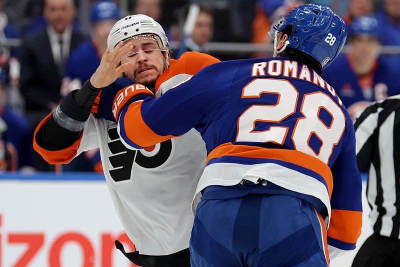 Jan 24, 2025; Elmont, New York, USA; Philadelphia Flyers right wing Travis Konecny (11) fights with New York Islanders defenseman Alexander Romanov (28) during the first period at UBS Arena. Mandatory Credit: Brad Penner-Imagn Images