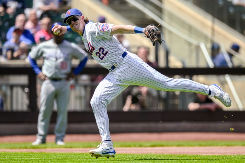 May 2, 2024; New York City, New York, USA; New York Mets third baseman Brett Baty (22) fields a ground ball and throws to first base for an out during the first inning against the Chicago Cubs at Citi Field. Mandatory Credit: John Jones-USA TODAY Sports