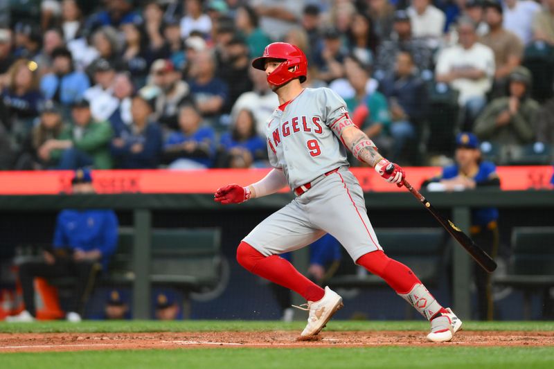 May 31, 2024; Seattle, Washington, USA; Los Angeles Angels shortstop Zach Neto (9) hits a single against the Seattle Mariners during the sixth inning at T-Mobile Park. Mandatory Credit: Steven Bisig-USA TODAY Sports