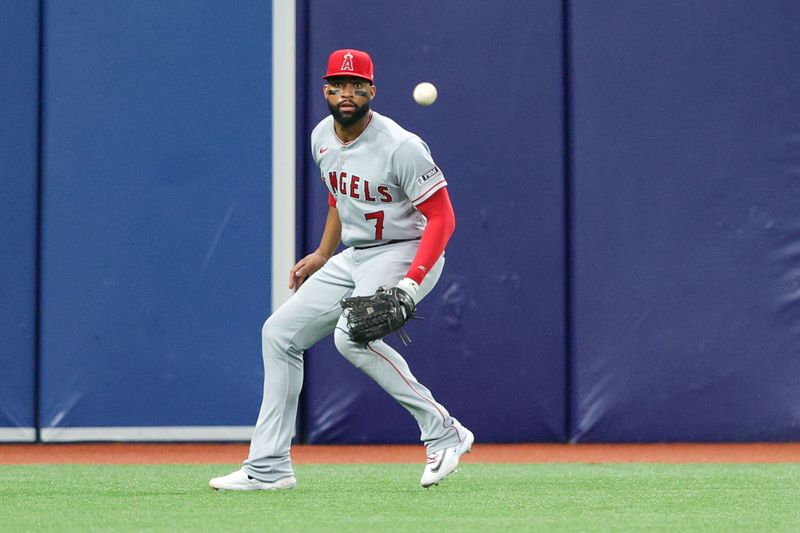 Sep 20, 2023; St. Petersburg, Florida, USA;  Los Angeles Angels left fielder Jo Adell (7) filed the ball against the Tampa Bay Rays in the third inning at Tropicana Field. Mandatory Credit: Nathan Ray Seebeck-USA TODAY Sports