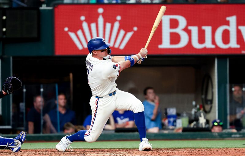 May 27, 2025; Arlington, Texas, USA; Texas Rangers third baseman Josh Jung (6) hits an rbi single during the eighth inning against the Toronto Blue Jays at Globe Life Field. Mandatory Credit: Kevin Jairaj-Imagn Images