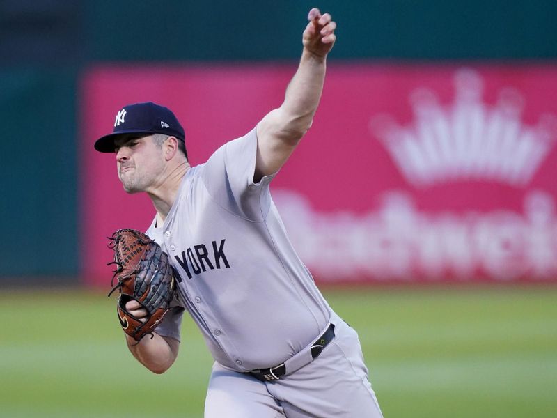 Sep 21, 2024; Oakland, California, USA; New York Yankees pitcher Carlos Rodon (55) delivers a pitch against the Oakland Athletics in the first inning at the Oakland-Alameda County Coliseum. Mandatory Credit: Cary Edmondson-Imagn Images