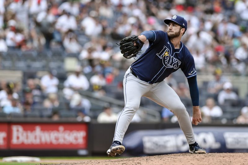 Jul 21, 2024; Bronx, New York, USA; Tampa Bay Rays pitcher Colin Poche (38) pitches against the New York Yankees during the sixth inning at Yankee Stadium. Mandatory Credit: John Jones-USA TODAY Sports