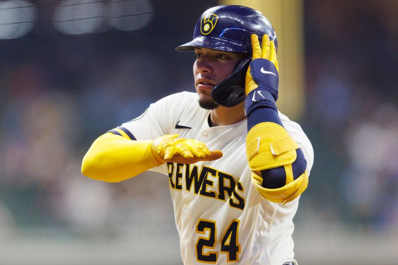 Aug 22, 2023; Milwaukee, Wisconsin, USA;  Milwaukee Brewers catcher William Contreras (24) gestures towards the dugout after hitting a single during the sixth inning against the Minnesota Twins at American Family Field. Mandatory Credit: Jeff Hanisch-USA TODAY Sports