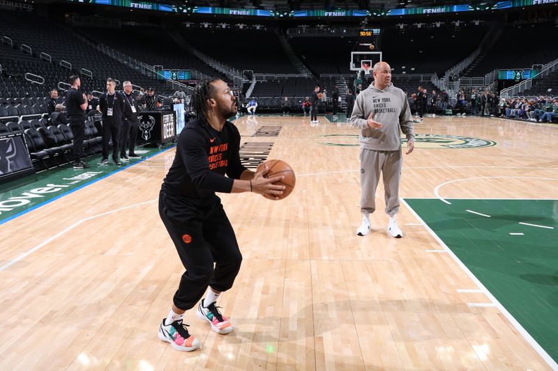 MILWAUKEE, WI - APRIL 7: Jalen Brunson #11 of the New York Knicks and Assistant Coach Rick Brunson warm up before the game against the Milwaukee Bucks on April 7, 2024 at the Fiserv Forum Center in Milwaukee, Wisconsin. NOTE TO USER: User expressly acknowledges and agrees that, by downloading and or using this Photograph, user is consenting to the terms and conditions of the Getty Images License Agreement. Mandatory Copyright Notice: Copyright 2024 NBAE (Photo by Jeff Haynes/NBAE via Getty Images).