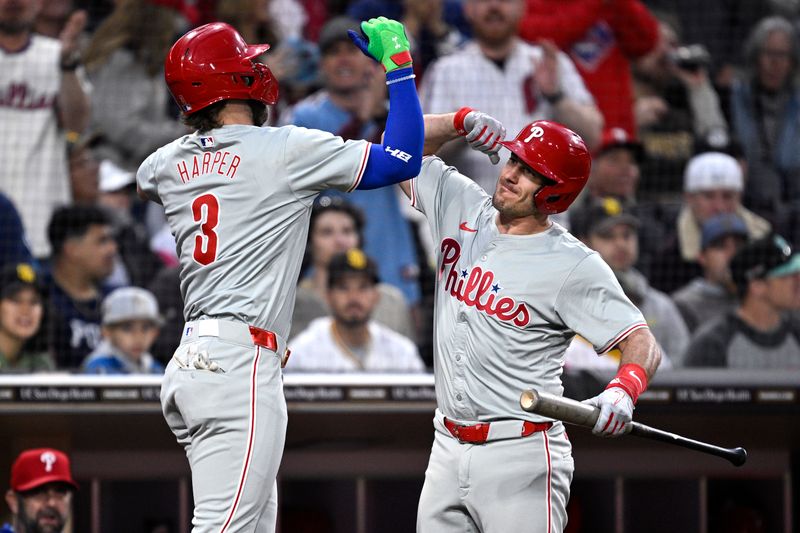 Apr 26, 2024; San Diego, California, USA; Philadelphia Phillies first baseman Bryce Harper (3) is congratulated by catcher J.T. Realmuto (10) after hitting a home run against the San Diego Padres during the third inning at Petco Park. Mandatory Credit: Orlando Ramirez-USA TODAY Sports