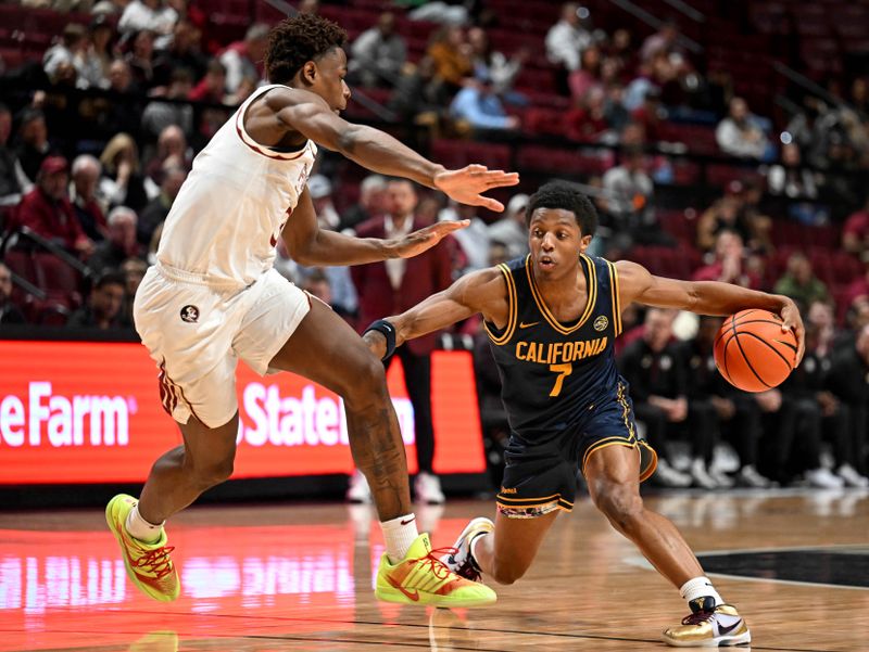 Jan 28, 2026; Tallahassee, Florida, USA; California Golden Bears Dai Dai Ames (7) drives to the net past Florida State Seminoles forward Thomas Bassong (3) during the second half at Donald L. Tucker Center. Mandatory Credit: Melina Myers-Imagn Images