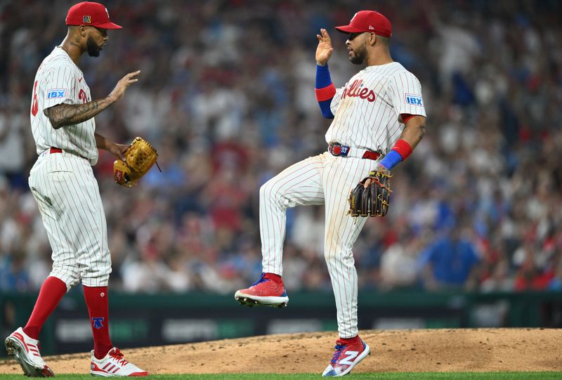 Aug 17, 2024; Philadelphia, Pennsylvania, USA; Philadelphia Phillies infielder Edmundo Sosa (33) reacts with starting pitcher Cristopher Sanchez (61) after turning a double play against the Washington Nationals in the eighth inning at Citizens Bank Park. Mandatory Credit: Kyle Ross-USA TODAY Sports