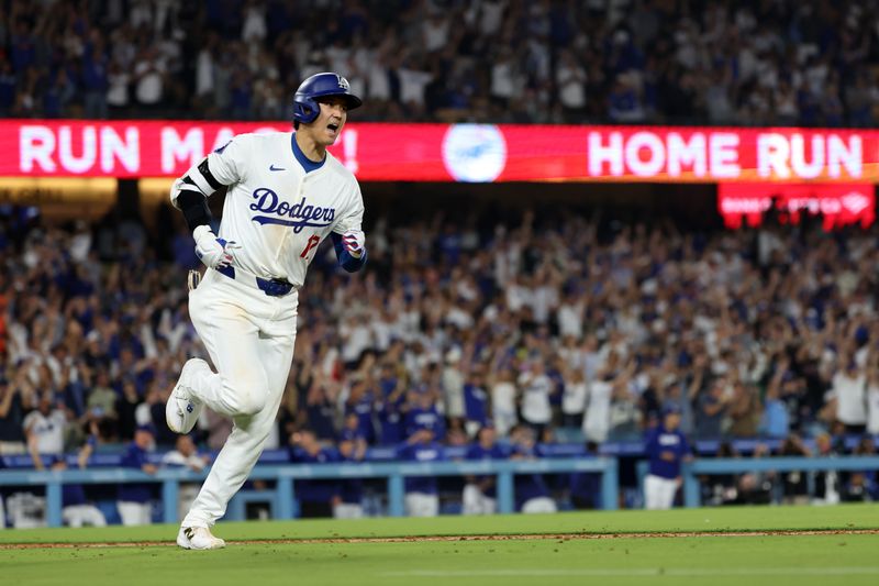 Jul 2, 2024; Los Angeles, California, USA;  Los Angeles Dodgers designated hitter Shohei Ohtani (17) reacts after hitting a two-run home run during the seventh inning against the Arizona Diamondbacks at Dodger Stadium. Mandatory Credit: Kiyoshi Mio-USA TODAY Sports