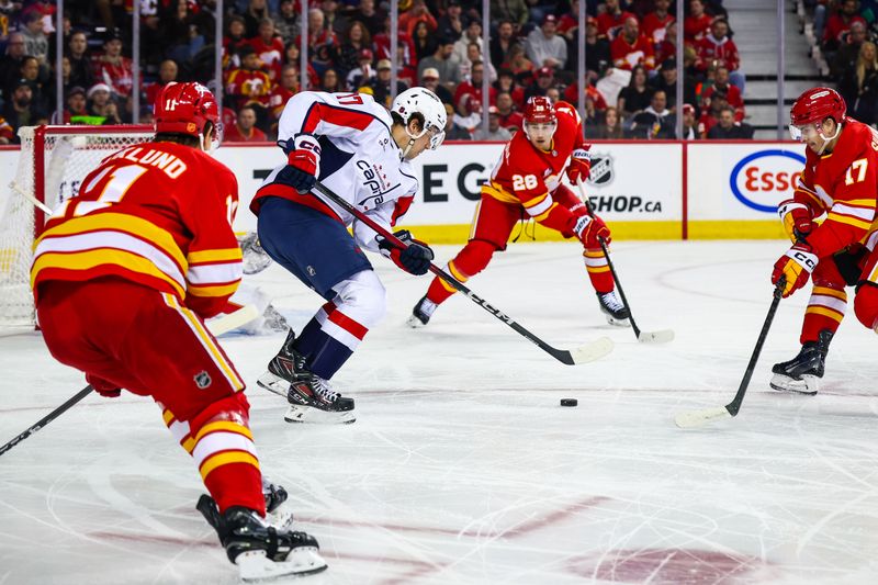 Jan 23, 2026; Calgary, Alberta, CAN; Washington Capitals center Dylan Strome (17) controls the puck against the Calgary Flames during the first period at Scotiabank Saddledome. Mandatory Credit: Sergei Belski-Imagn Images