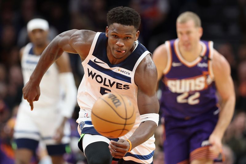 PHOENIX, ARIZONA - JANUARY 29: Anthony Edwards #5 of the Minnesota Timberwolves steals the ball during the second half of the NBA game against the Phoenix Suns at Footprint Center on January 29, 2025 in Phoenix, Arizona. NOTE TO USER: User expressly acknowledges and agrees that, by downloading and or using this photograph, User is consenting to the terms and conditions of the Getty Images License Agreement.  (Photo by Christian Petersen/Getty Images)