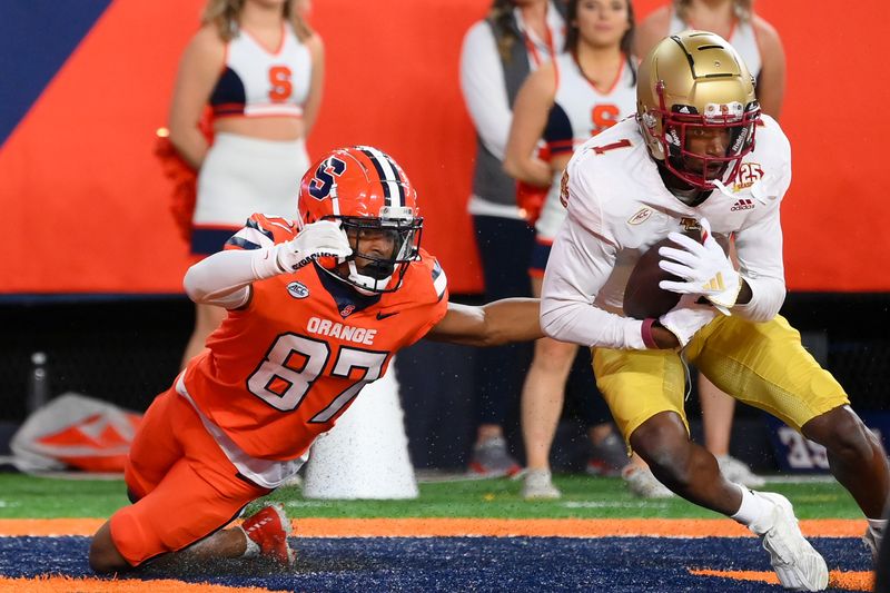 Nov 3, 2023; Syracuse, New York, USA; Boston College Eagles defensive back Elijah Jones (1) intercepts a pass in the end zone in front of Syracuse Orange wide receiver Donovan Brown (87) during the first half at the JMA Wireless Dome. Mandatory Credit: Rich Barnes-USA TODAY Sports