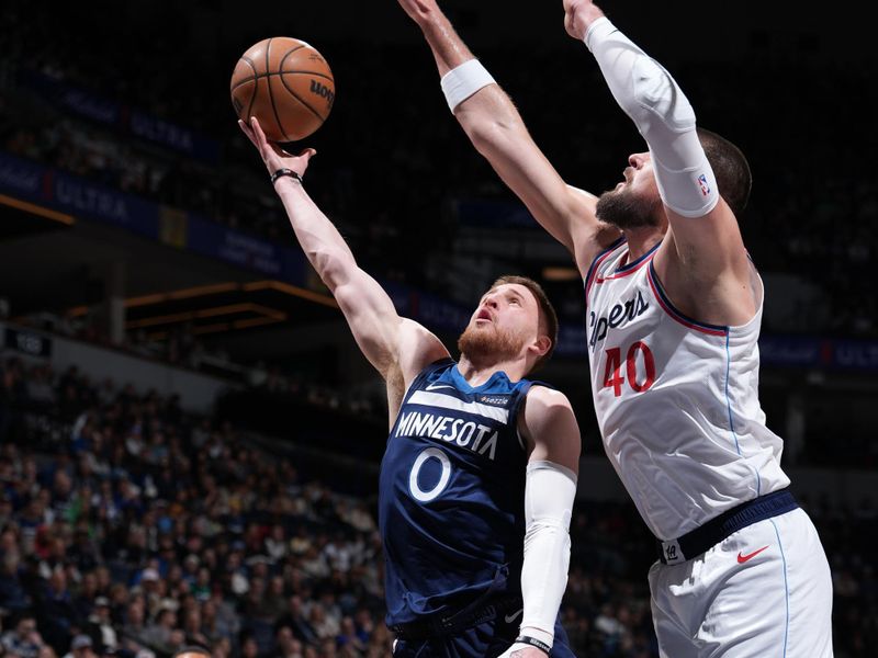 MINNEAPOLIS, MN -  JANUARY 6: Donte DiVincenzo #0 of the Minnesota Timberwolves drives to the basket during the game against the LA Clippers on January 6, 2025 at Target Center in Minneapolis, Minnesota. NOTE TO USER: User expressly acknowledges and agrees that, by downloading and or using this Photograph, user is consenting to the terms and conditions of the Getty Images License Agreement. Mandatory Copyright Notice: Copyright 2025 NBAE (Photo by Jordan Johnson/NBAE via Getty Images)