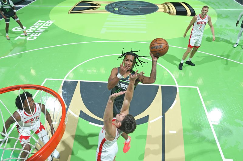 MINNEAPOLIS, MN -  NOVEMBER 26: Rob Dillingham #4 of the Minnesota Timberwolves drives to the basket during the game against the Houston Rockets during the Emirates NBA Cup game on November 26, 2024 at Target Center in Minneapolis, Minnesota. NOTE TO USER: User expressly acknowledges and agrees that, by downloading and or using this Photograph, user is consenting to the terms and conditions of the Getty Images License Agreement. Mandatory Copyright Notice: Copyright 2024 NBAE (Photo by David Sherman/NBAE via Getty Images)