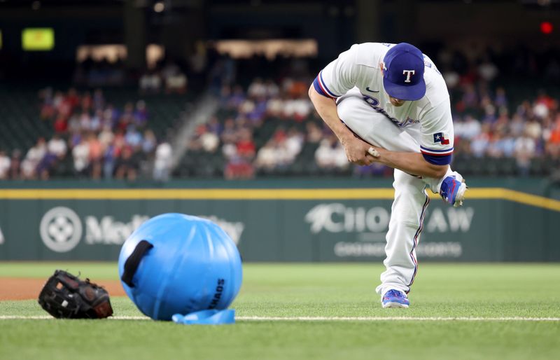 Oct 20, 2023; Arlington, Texas, USA; Texas Rangers shortstop Corey Seager (5) stretches before game five in the ALCS against the Houston Astros for the 2023 MLB playoffs at Globe Life Field. Mandatory Credit: Kevin Jairaj-USA TODAY Sports