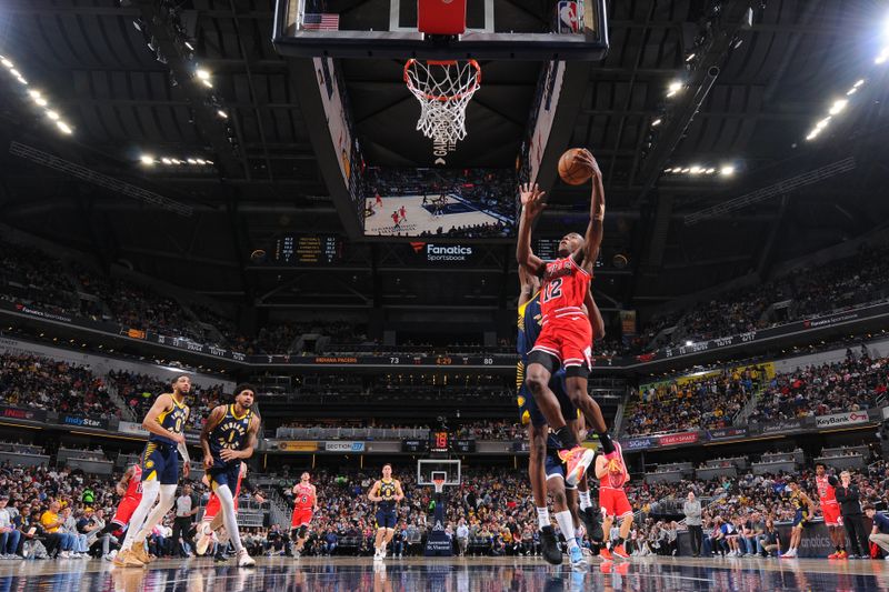 INDIANAPOLIS, IN - MARCH 13:  Ayo Dosunmu #12 of the Chicago Bulls goes to the basket during the game on March 13, 2024 at Gainbridge Fieldhouse in Indianapolis, Indiana. NOTE TO USER: User expressly acknowledges and agrees that, by downloading and or using this Photograph, user is consenting to the terms and conditions of the Getty Images License Agreement. Mandatory Copyright Notice: Copyright 2024 NBAE (Photo by Ron Hoskins/NBAE via Getty Images)