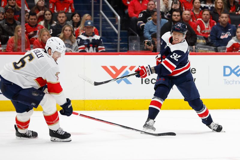 Nov 8, 2023; Washington, District of Columbia, USA; Florida Panthers defenseman Mike Reilly (6) deflects a shot by Washington Capitals center Evgeny Kuznetsov (92) in the third period at Capital One Arena. Mandatory Credit: Geoff Burke-USA TODAY Sports