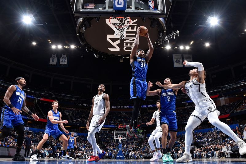 ORLANDO, FL - FEBRUARY 27: Wendell Carter Jr. #34 of the Orlando Magic grabs a rebound during the game against the Brooklyn Nets on February 27, 2024 at the Kia Center in Orlando, Florida. NOTE TO USER: User expressly acknowledges and agrees that, by downloading and or using this photograph, User is consenting to the terms and conditions of the Getty Images License Agreement. Mandatory Copyright Notice: Copyright 2024 NBAE (Photo by Fernando Medina/NBAE via Getty Images)