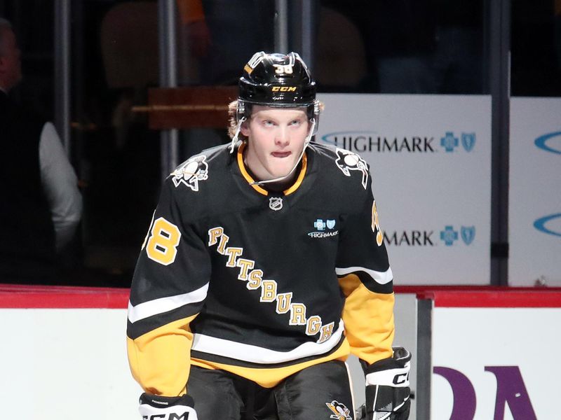 Dec 3, 2024; Pittsburgh, Pennsylvania, USA;  Pittsburgh Penguins defenseman Owen Pickering (38) reacts to being named a star of the game against the Florida Panthers at PPG Paints Arena. Mandatory Credit: Charles LeClaire-Imagn Images
