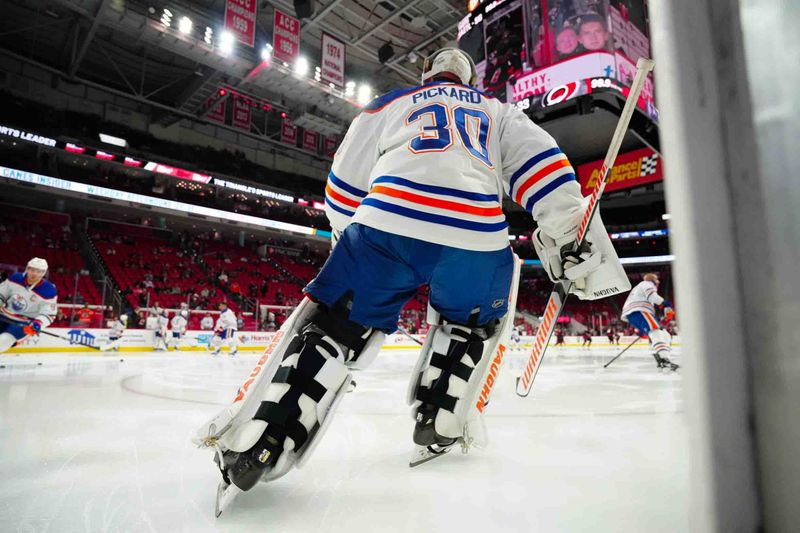 Nov 22, 2023; Raleigh, North Carolina, USA; Edmonton Oilers goaltender Calvin Pickard (30) skates out onto the ice for the warmups before the game against the Carolina Hurricanes at PNC Arena. Mandatory Credit: James Guillory-USA TODAY Sports