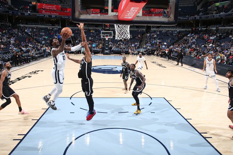 MEMPHIS, TN - February 26:  Jaren Jackson Jr. #13 of the Memphis Grizzlies drives to the basket during the game against the Brooklyn Nets on February 26, 2024 at FedExForum in Memphis, Tennessee. NOTE TO USER: User expressly acknowledges and agrees that, by downloading and or using this photograph, User is consenting to the terms and conditions of the Getty Images License Agreement. Mandatory Copyright Notice: Copyright 2024 NBAE (Photo by Joe Murphy/NBAE via Getty Images)