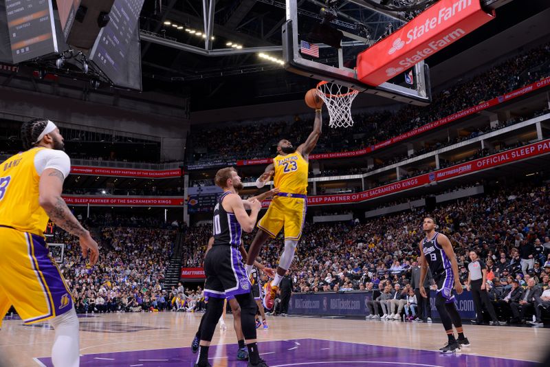 SACRAMENTO, CA - MARCH 13:  LeBron James #23 of the Los Angeles Lakers drives to the basket during the game against the Sacramento Kings on March 13, 2024 at Golden 1 Center in Sacramento, California. NOTE TO USER: User expressly acknowledges and agrees that, by downloading and or using this Photograph, user is consenting to the terms and conditions of the Getty Images License Agreement. Mandatory Copyright Notice: Copyright 2024 NBAE (Photo by Rocky Widner/NBAE via Getty Images)